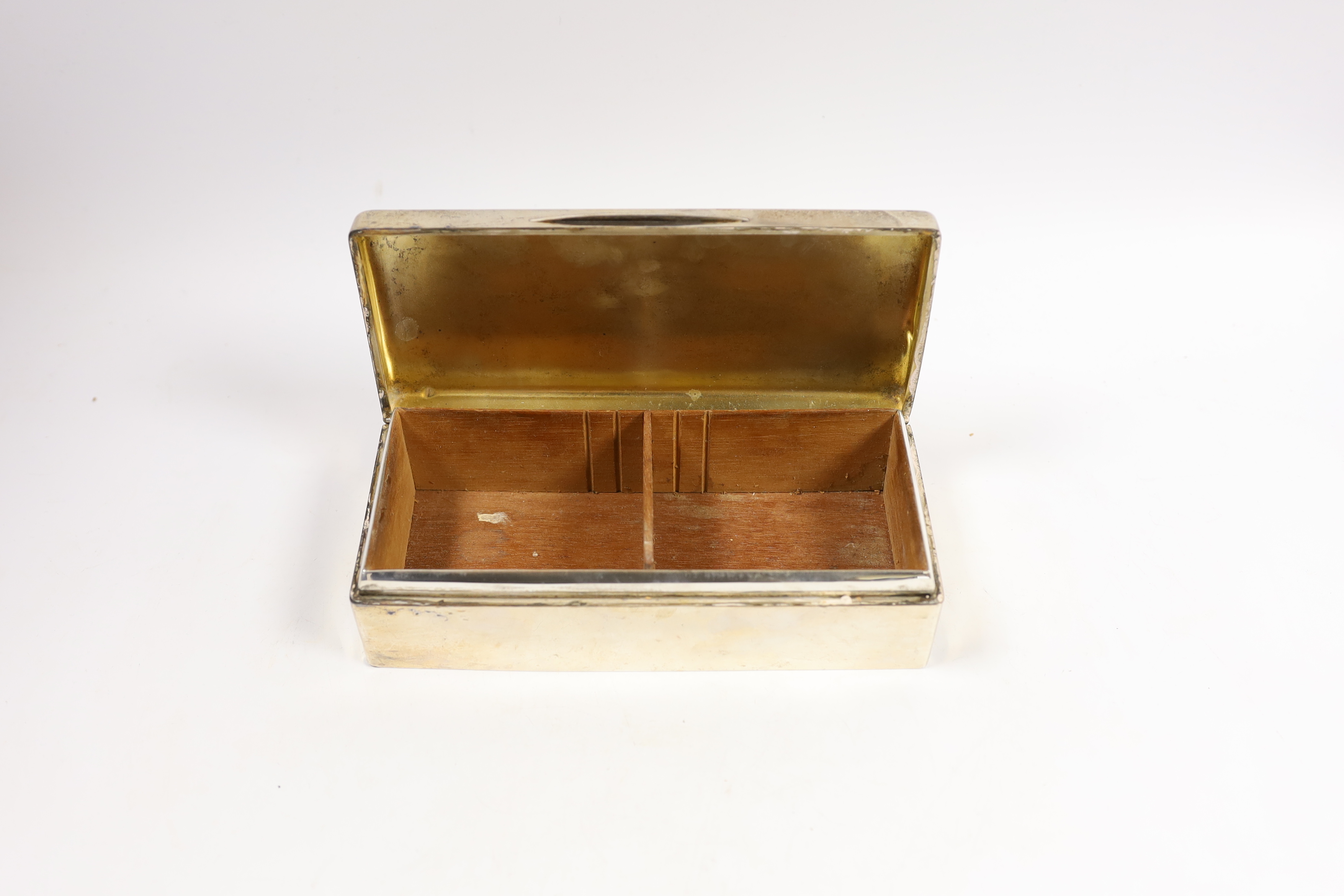 A George V silver rectangular cigarette box, London, 1918, 20.3cm.